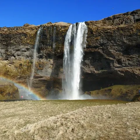 A waterfall with a rainbow on the south coast