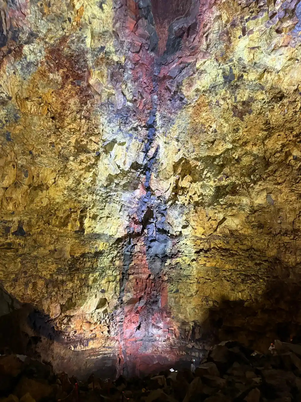 A wall of gold and pink above the shadowed lower chamber